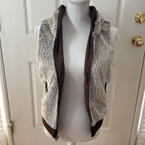 brown and tan patagonia fur vest